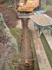 trench being backfilled