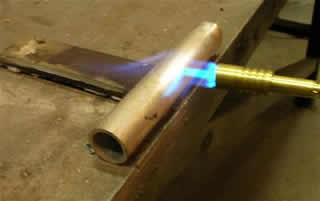heat metal with blowtorch