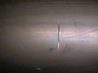 Slit in copper cylinder damaged copper cylinder